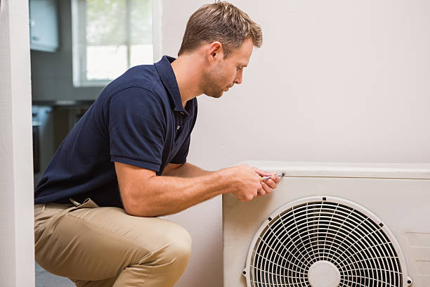 istock Focused handyman fixing air conditioning 528167477