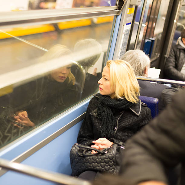 istock Woman looking out metro's window. 528179613