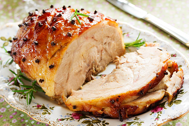 istock Roast pork with orange glaze, decorated with cloves. 528180485