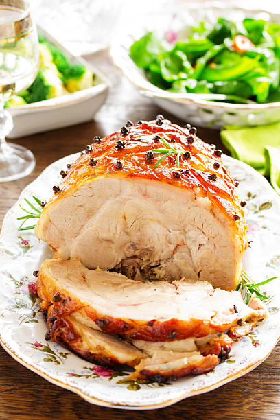 istock Roast pork with orange glaze, decorated with cloves. 528180487