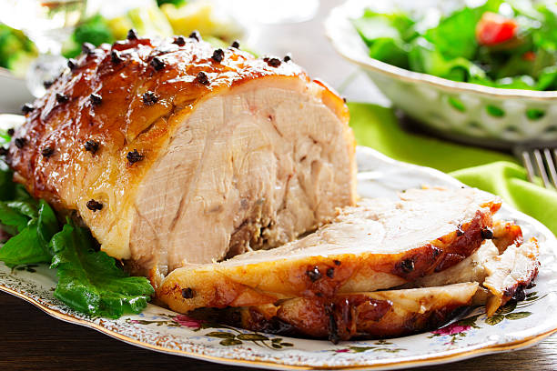 istock Roast pork with orange glaze, decorated with cloves. 528180489