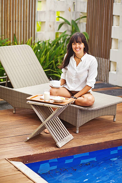 istock Woman having her breakfast in a garden 528181231