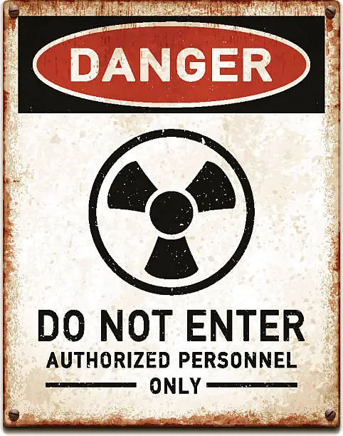 Vector illustration of Weathered metallic placard with danger radioactive trefoil symbol_vector