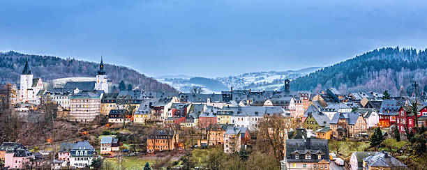 Panoramic view on Schwarzenberg (Erzgebirge) in winter Panoramic view on the mining town of Schwarzenberg (Erzgebirge / Ore Mountains) illuminated by christmas lights on a winter day. erzgebirge stock pictures, royalty-free photos & images