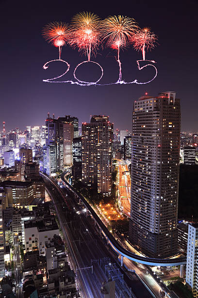 2015 New Year Fireworks celebrating over Tokyo cityscape at night, Japan