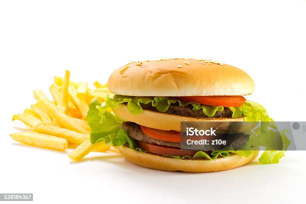 Big And Tasty Hamburger And Fried Potatoes Isolated Stock Photo - Download Image Now