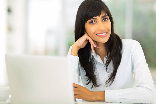 istock young indian businesswoman sitting in office 528195437