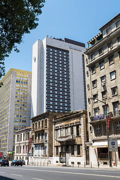 Lisbon, Portugal - August 17, 2014: The Sheraton Hotel is near the business district. In the picture you can see the profound transformation of the neighborhood with old buildings in ruins pending demolition or alterations