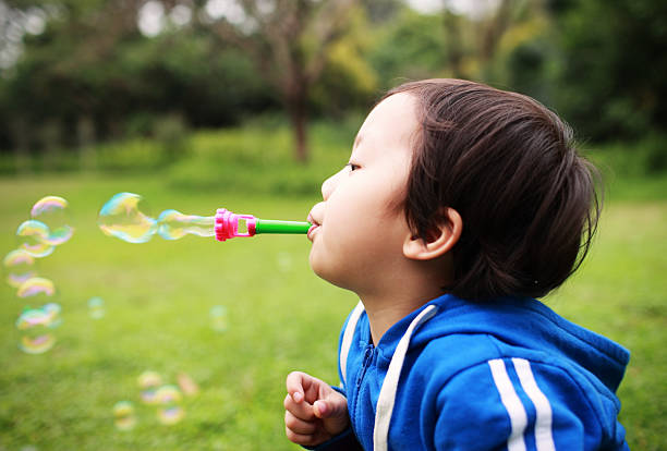 istock Cute children playing in the park 528195817