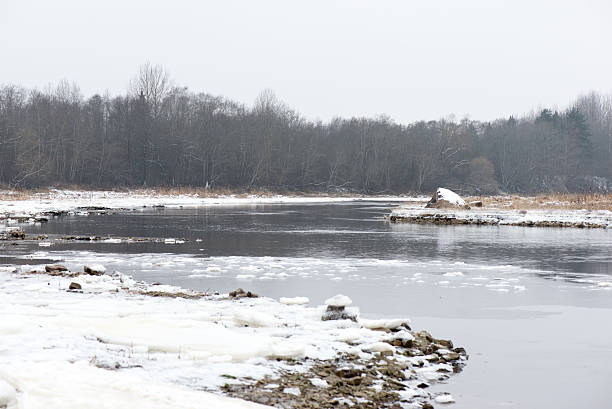 istock cold winter landscape with frozen river 528196949