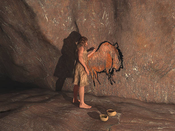 Caveman painting in a cave stock photo