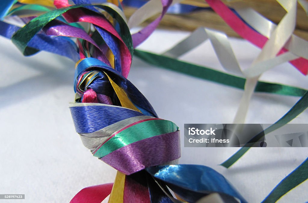 Knot of party ribbons on white background Anniversary Stock Photo