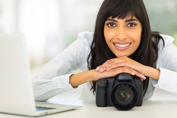 istock relaxed young indian photographer 528198787