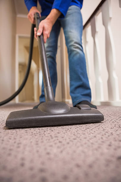 istock Close up a young man vacuuming 528199269