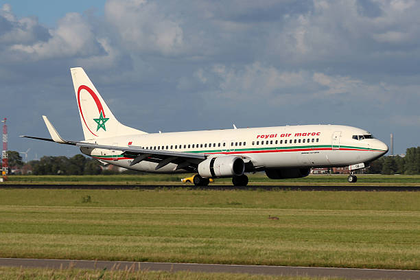 Royal Air Maroc Amsterdam, Netherlands - July 1, 2012: Royal Air Maroc Boeing B737-800 lands at AMS Airport in Netherlands on July.  landing touching down stock pictures, royalty-free photos & images