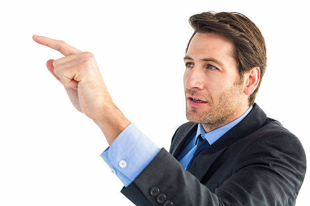 istock Serious businessman pointing at something 528212269