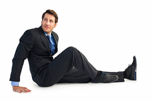 istock Businessman in suit sitting on floor 528212321