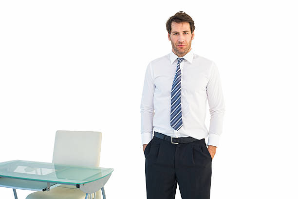 istock Businessman standing with hands in pockets 528212531