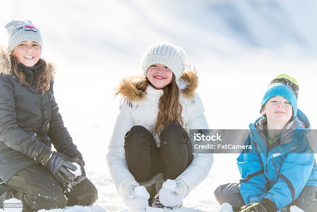 Winter Fun on Tobbogan Hill Kids having fun on the tobbogan hill 10-11 Years Stock Photo