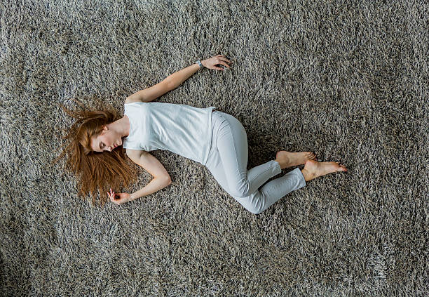 istock Young woman laying on the carpet 528213331