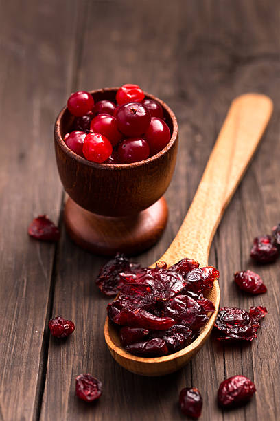 istock Dried cranberries on a wood spoon 528213925