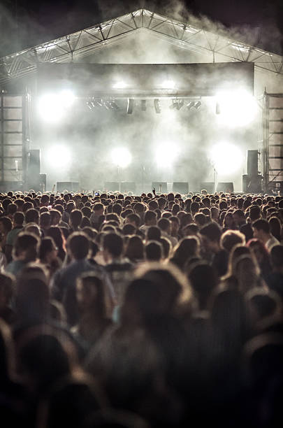 istock vertical scenario light white smoke people unrecognizable music festival 528214641