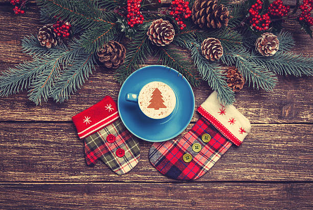 istock Hot cappuccino with christmas tree shape on a wooden table 528216239