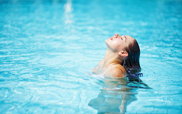 istock Woman in pool 528216943