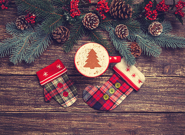 istock Hot cappuccino with christmas tree shape on a wooden table 528218449