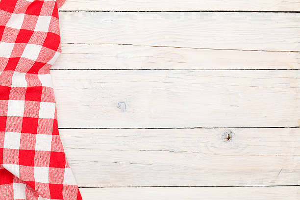 istock Red towel over wooden kitchen table 528218463