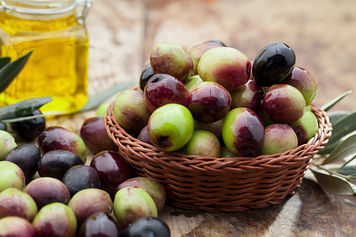 Raw olives in basket.