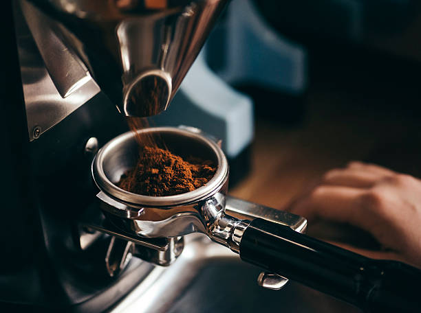 istock freshly ground coffee beans in a portafilter 528280266