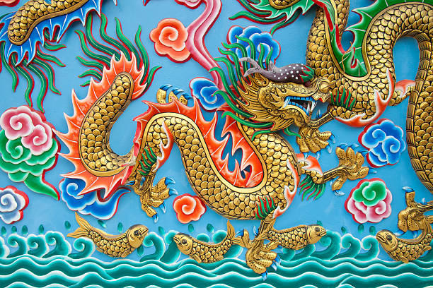 istock Golden dragon statue on blue wall 528280504