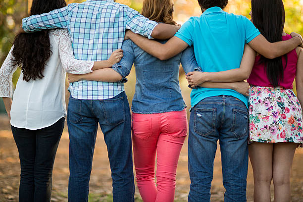 istock Group of friends with backs to camera 528281654