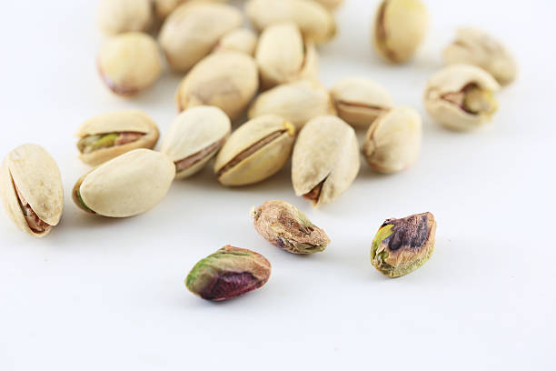istock Pistachois nuts on white background. 528284606