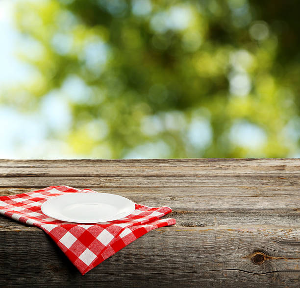 istock Background with wooden table with white plate 528284912
