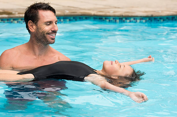 istock Little girl learning swimming 528285544