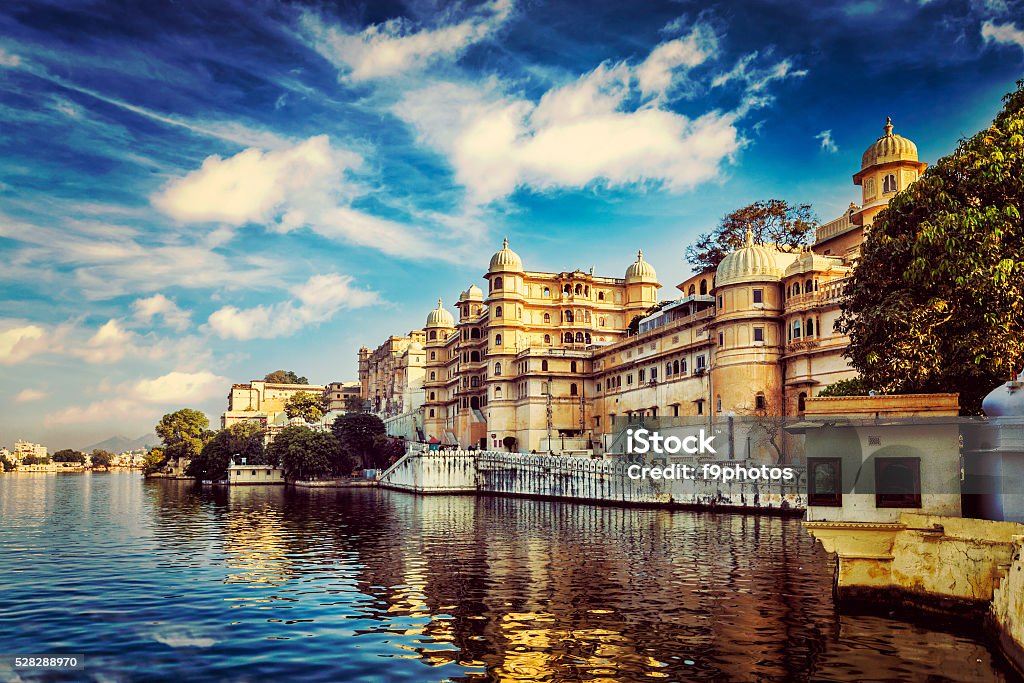 City Palace. Udaipur, India Romantic India luxury tourism wallpaper  - Vintage retro effect filtered hipster style image of Udaipur City Palace and Lake Pichola. Udaipur, Rajasthan, India Udaipur Stock Photo