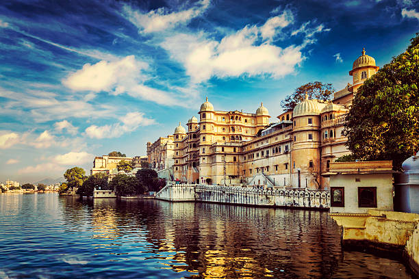 City Palace. Udaipur, India Romantic India luxury tourism wallpaper  - Vintage retro effect filtered hipster style image of Udaipur City Palace and Lake Pichola. Udaipur, Rajasthan, India udaipur stock pictures, royalty-free photos & images