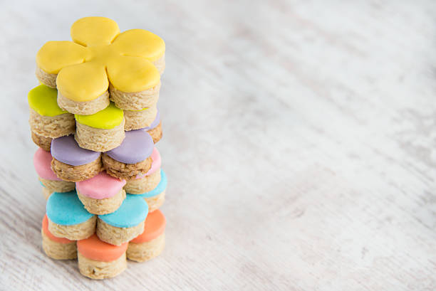 Colorful flower form homemade fondant covered cookies