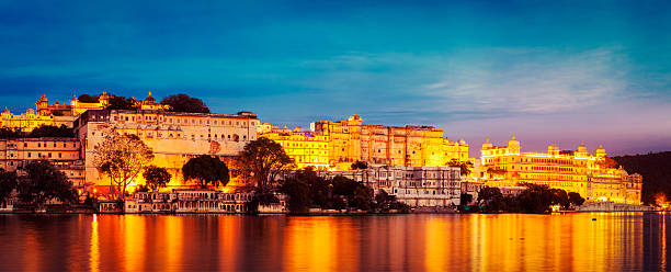 istock Udaipur City Palace in the evening panoramic view. Udaipur, Indi 528289474