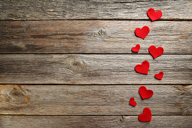 istock Red hearts on a grey wooden table 528290478