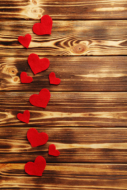 istock Red hearts on a brown wooden table 528290774