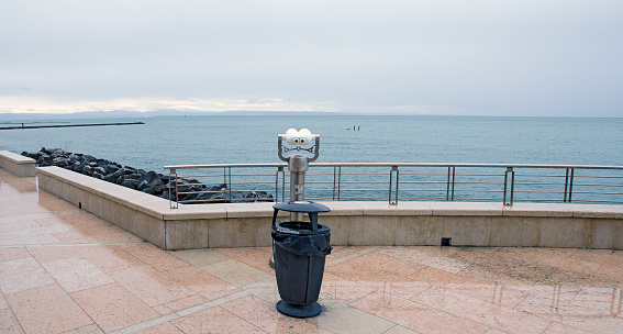 coin-operated binocular at the esplanade of Grado, Italy