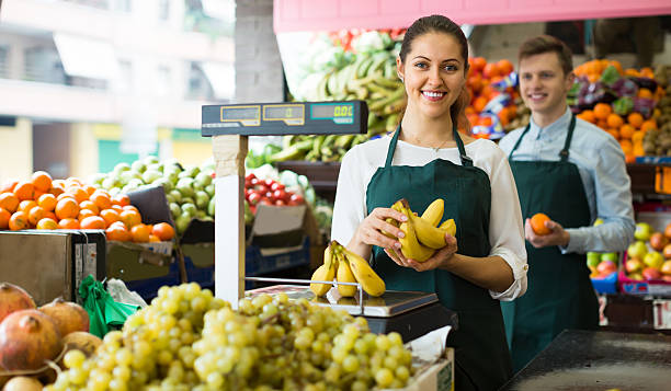 istock Sellers with bananas at market 528291182