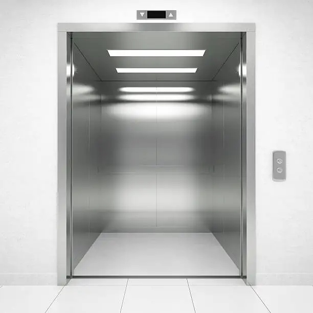 Inside of a empty modern elevator.