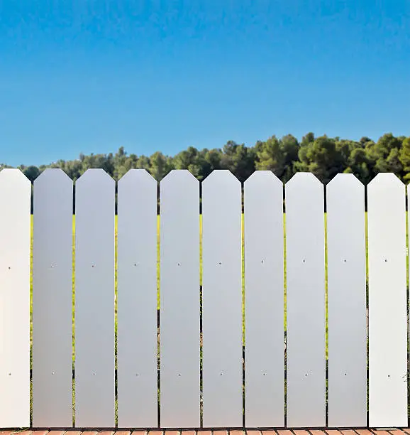 aluminum fence at the countryside with the blue sky in background