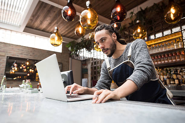 istock Business owner doing the books at a restaurant 528291972