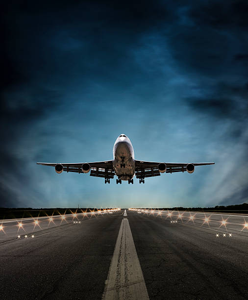 istock Passenger airplane landing at dusk 528294656