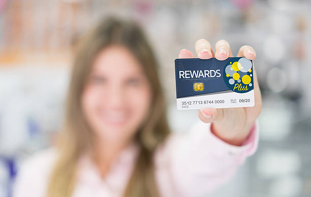 istock Woman holding a loyalty card 528296988